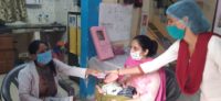 MOIC distributing contraceptive at Maharajpur UPHC, Ghaziabad, UP, India 