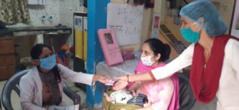 MOIC distributing contraceptive at Maharajpur UPHC, Ghaziabad, UP, India