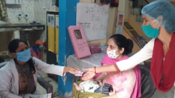 MOIC distributing contraceptive at Maharajpur UPHC, Ghaziabad, UP, India